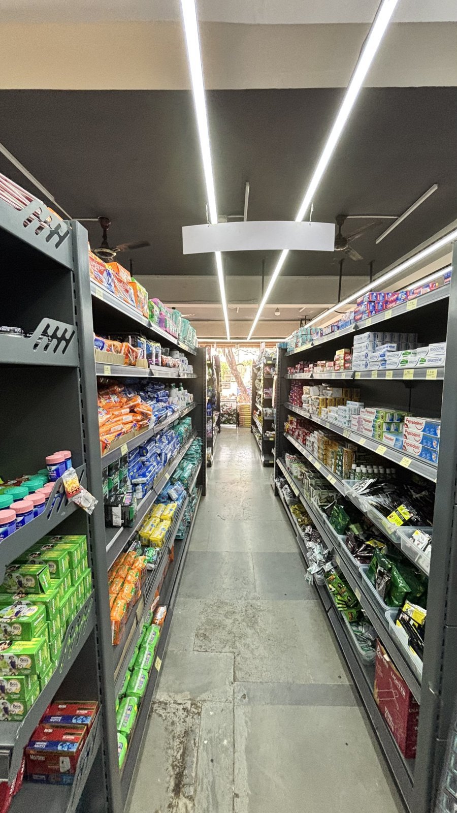 Grocery aisle and displays inside an OLTOWNS store